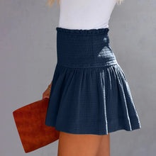 Navy blue pleated high elastic waist textured shorts side angle.