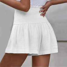 White pleated high elastic waist textured shorts back view.