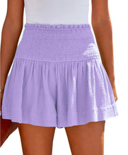 Purple smocked skirt worn by a person on a white background.