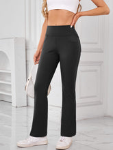 Side profile of AuriCore Flexion black Pocket Pants showing sleek silhouette.