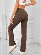 Rear view close-up of pocket detail and fabric texture on AuriCore Flexion brown Pants.