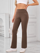 Side profile of AuriCore Flexion Brown Pocket Pants showing sleek silhouette.