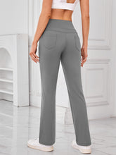 Back view of AuriCore Flexion Gray Pocket Pants highlighting snug high-waist fit.