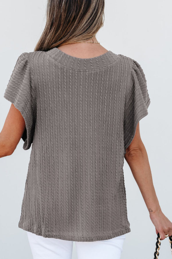 Back view displaying overall design and texture of the gray RuffleRidge Blouse.