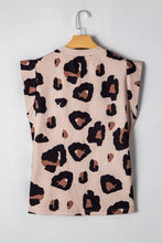 Back view of the leopard print T-shirt showing a clean, seamless design with cap sleeves and relaxed fit, on a hanger.