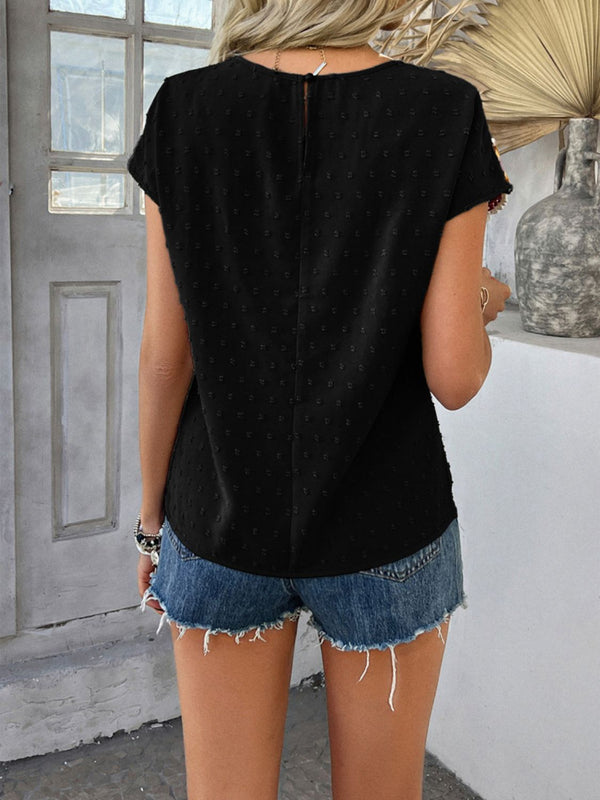 Back view displaying the black CrochetCharm Top's back button closure and overall design.