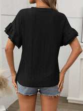 Back view of the Contrast Round Neck Short Sleeve Blouse in Black, showing relaxed fit and contrast neckline detail.