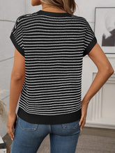 Back view of Black striped knit top showing smooth fit and clean stripe alignment, worn with washed jeans.
