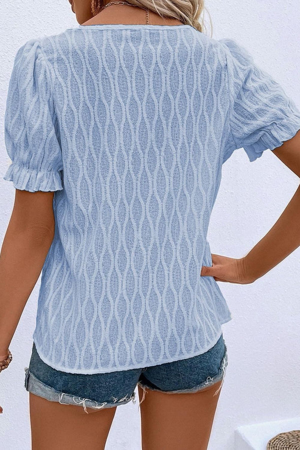 Back view displaying the cerulean blouse's overall fit and texture.