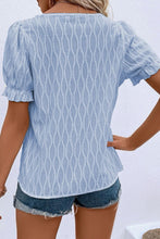 Back view displaying the cerulean blouse's overall fit and texture.