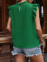 Back view of a frill mock neck ruffled cap sleeve blouse in dark green, showing the ruffle neckline and clean back detail.