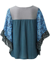 Back view of the BlossomEase Blouse in dusty blue, featuring floral three-quarter sleeves and soft cotton blend.