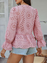 Back view showcasing round neckline of the Dusty Pink PeplumMuse™ Blouse on a model paired with light washed wide legs, jewelry, and loafers.