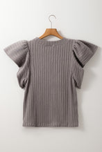 Back view displaying overall design and texture of the gray RuffleRidge Top on a hanger.
