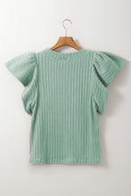 Back view displaying overall design and texture of the gum leaf RuffleRidge Top on a hanger.