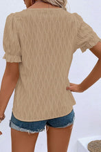 Back view displaying the khaki blouse's overall fit and texture.