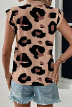 Back view of the leopard print T-shirt showing a clean, seamless design with cap sleeves and relaxed fit.