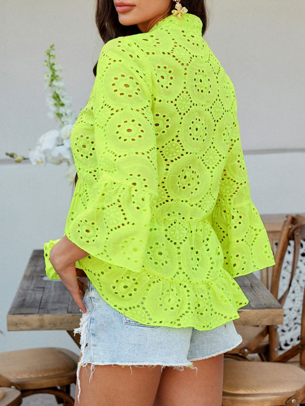 Back view of Luméa™ Blouse in Neon Yellow, highlighting the peplum silhouette, accessorized with gold jewelry and heels.