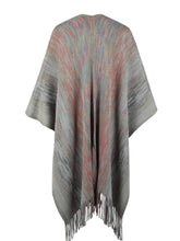 Back view of charcoal Heathered Fringe Hem Poncho against a plain background, featuring textured knit fabric and pom pom fringe along the bottom edge.