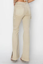 Back view of RISEN High Rise Side Slit Cargo Bootcut Jeans in stone with cargo pockets.