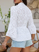 Back view of Luméa™ Blouse in White, highlighting the peplum silhouette, accessorized with gold jewelry and heels.