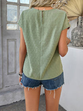 Back view displaying the sage CrochetCharm Top's back button closure and overall design.