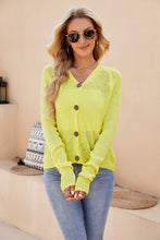 Front view of a woman wearing the Solavelle V-Neck Cardigan in banana yellow, featuring a flattering V-neckline, button-up front, and long sleeves.