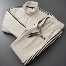 beige auralyss elite stripe zip jacket and pants set front folded view