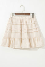 Elunari Ruffled Hem Mini Skirt front view displayed on hanger