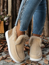 a model wearing the beige Furry Suede Round Toe Flat Sneakers