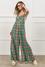 BiBi Jade/Pink Overalls accessorized with stacked bangles and bold lipstick for a night out.
