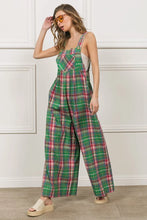 Full front view of model in BiBi Jade/Pink Plaid Overalls styled with a white crop tee.
