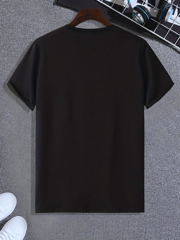 Back view of men’s black Cosmic Voyager astronaut graphic tee styled on hanger with white sneakers