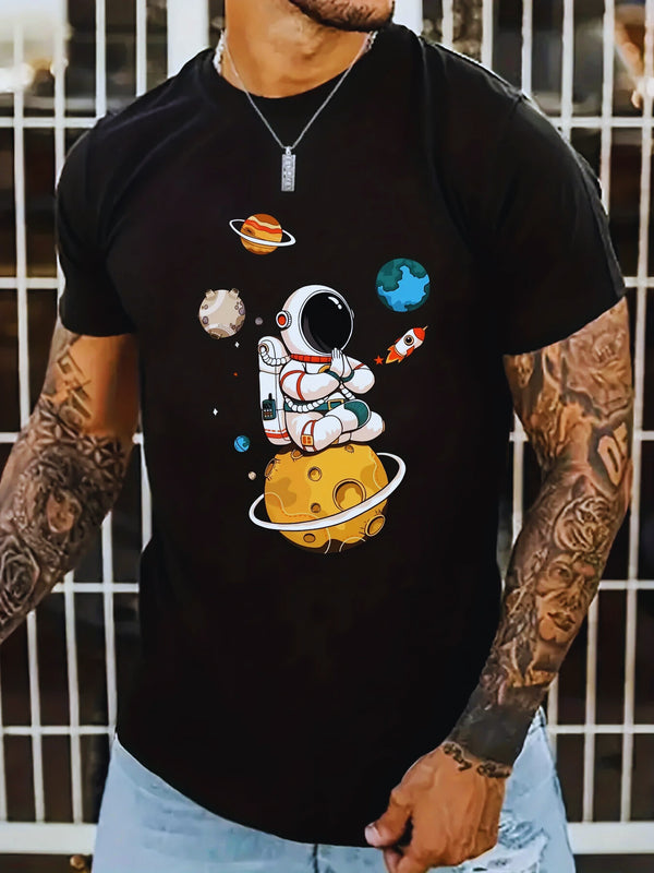 Model front view wearing men’s black Cosmic Voyager astronaut graphic tee