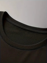 Close-up of round neckline stitching on black Cosmic Voyager astronaut graphic tee