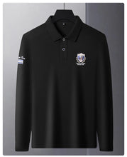 Front view of black Equestrian Crest Designer Polo on hanger.