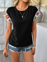 Model styled in black CrochetCharm Top with distressed jean shorts, sneakers, and accessories for a complete look.
