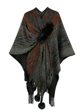 Front view of black Heathered Fringe Hem Poncho displayed flat, highlighting its textured knit finish, subtle multicolor accents, and fringe hem.