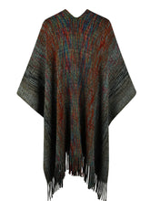 Back view of black Heathered Fringe Hem Poncho laid flat, with focus on the soft knit texture, subtle multicolor threads, and playful pom pom fringe.
