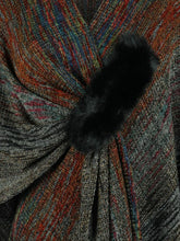Detailed close-up of black Heathered Fringe Hem Poncho, showcasing the intricate knit texture, subtle multicolor contrast, and delicate pom pom fringe.