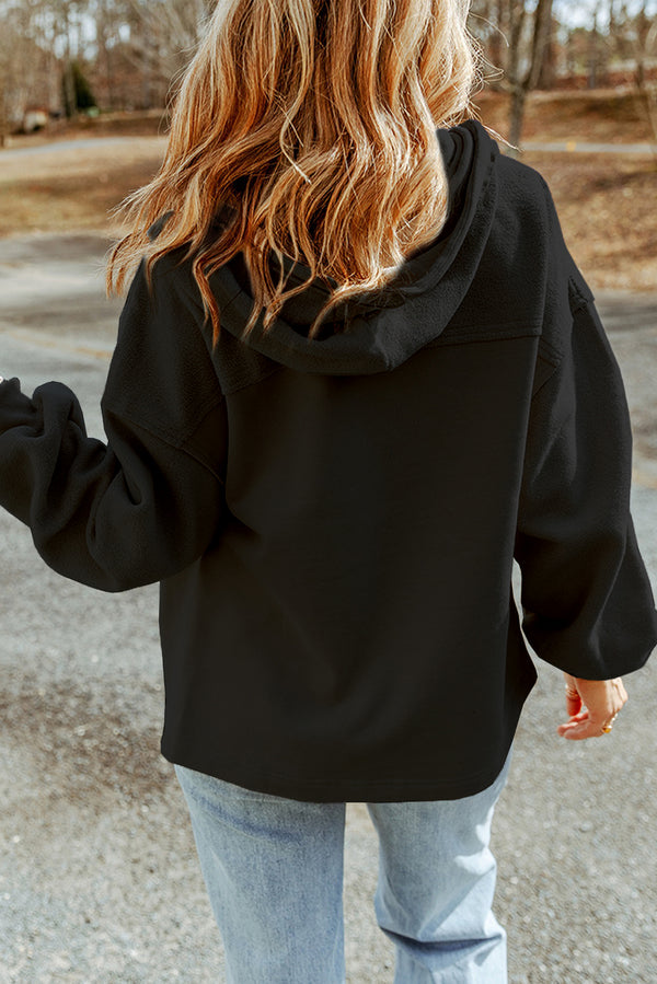 Back view of the black Nivora™ DriftZip Hooded Jacket, highlighting the relaxed fit, drawstring hood, and clean seam detailing.