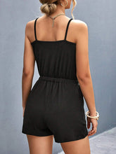 Rear view highlighting adjustable buckle straps and relaxed fit, emphasizing comfort and style, in black.