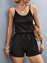 Sunkiss Move Romper in black styled with ankle boots and a denim jacket, perfect for a day-to-night transition.