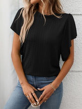 Close-up image of the flutter sleeve hem and round neckline on the black Round Neck Flutter Sleeve T-Shirt, showcasing fabric texture.