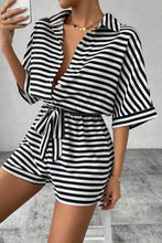 Front view of LineaVerra™ Striped Black Romper with waist tie and collar.