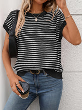 Model wearing Striped Round Neck Knit Top in black, paired with denim jeans for a chic casual daytime look.