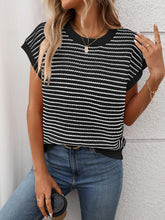 Model wearing Striped Round Neck Knit Top in black, paired with denim jeans for a chic casual daytime look.