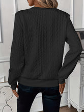 a model showcasing the back of a black Sunset Coastal Bliss Texture Half Zip Long Sleeve Sweatshirt paired with dark blue jeans and jewelry