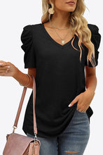 Front view of black V-neck puff sleeve T-shirt featuring subtle sleeve volume and a relaxed, feminine fit.