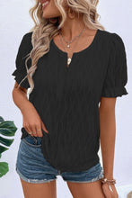 Model wearing Black Wavelle Blouse paired with casual pants and accessories.